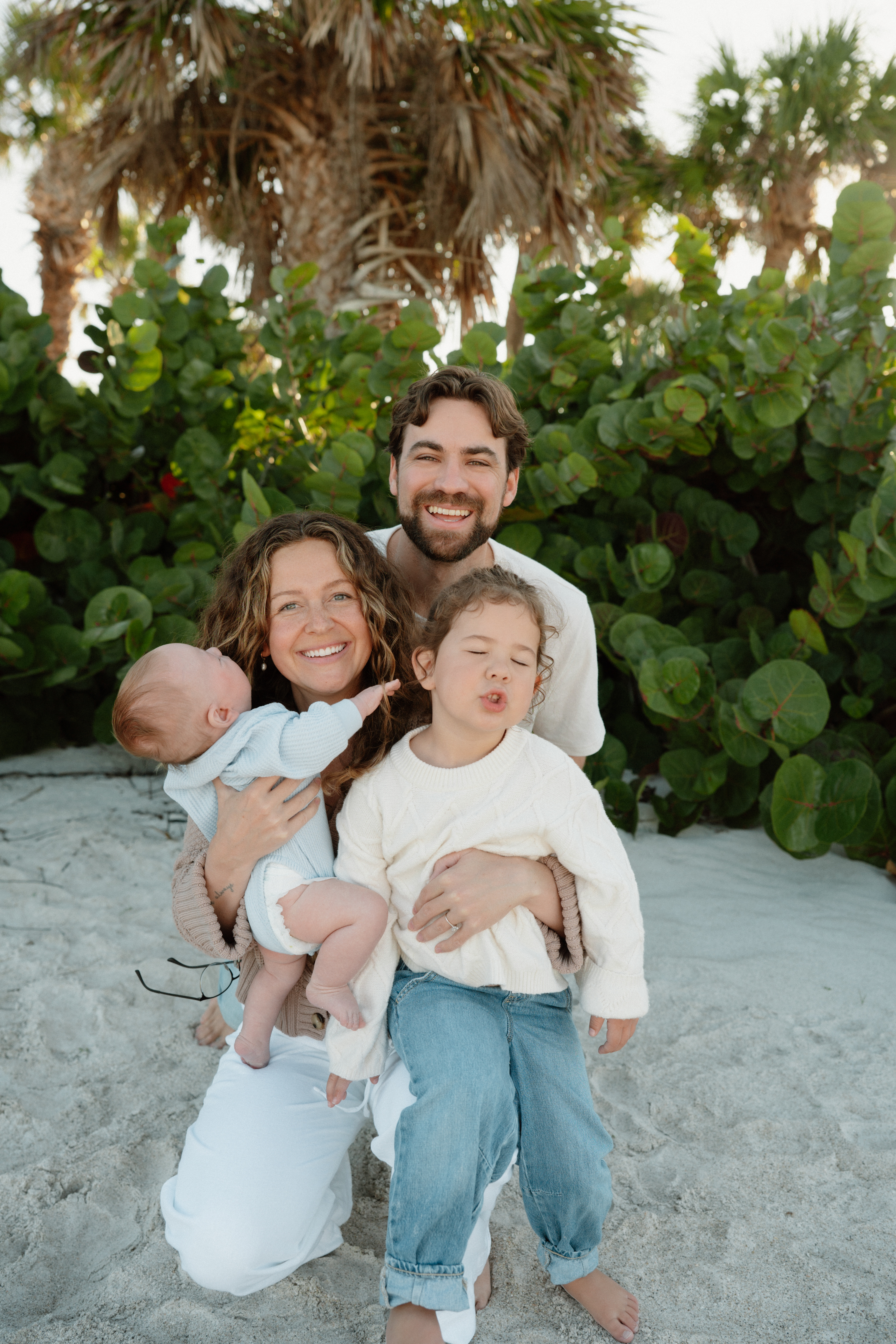 Luke Warner smiling with his family.